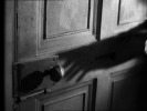 Number Seventeen (1932)door handle, hands and shadow